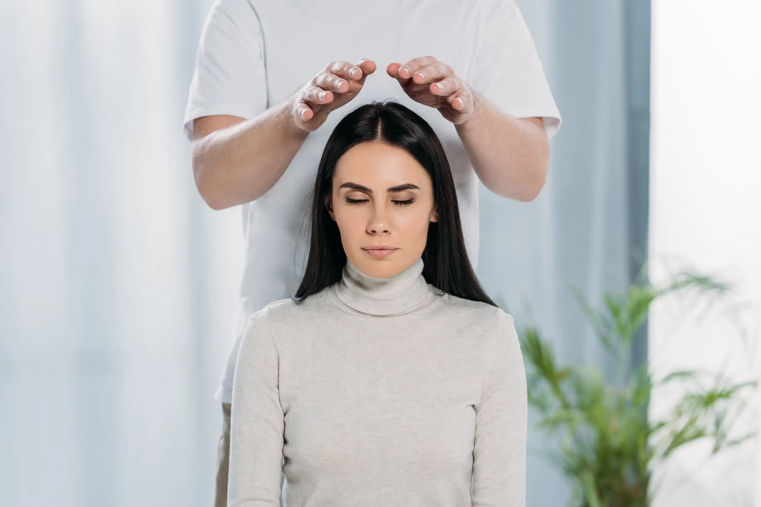 A woman getting her chakra and spiritually balanced.