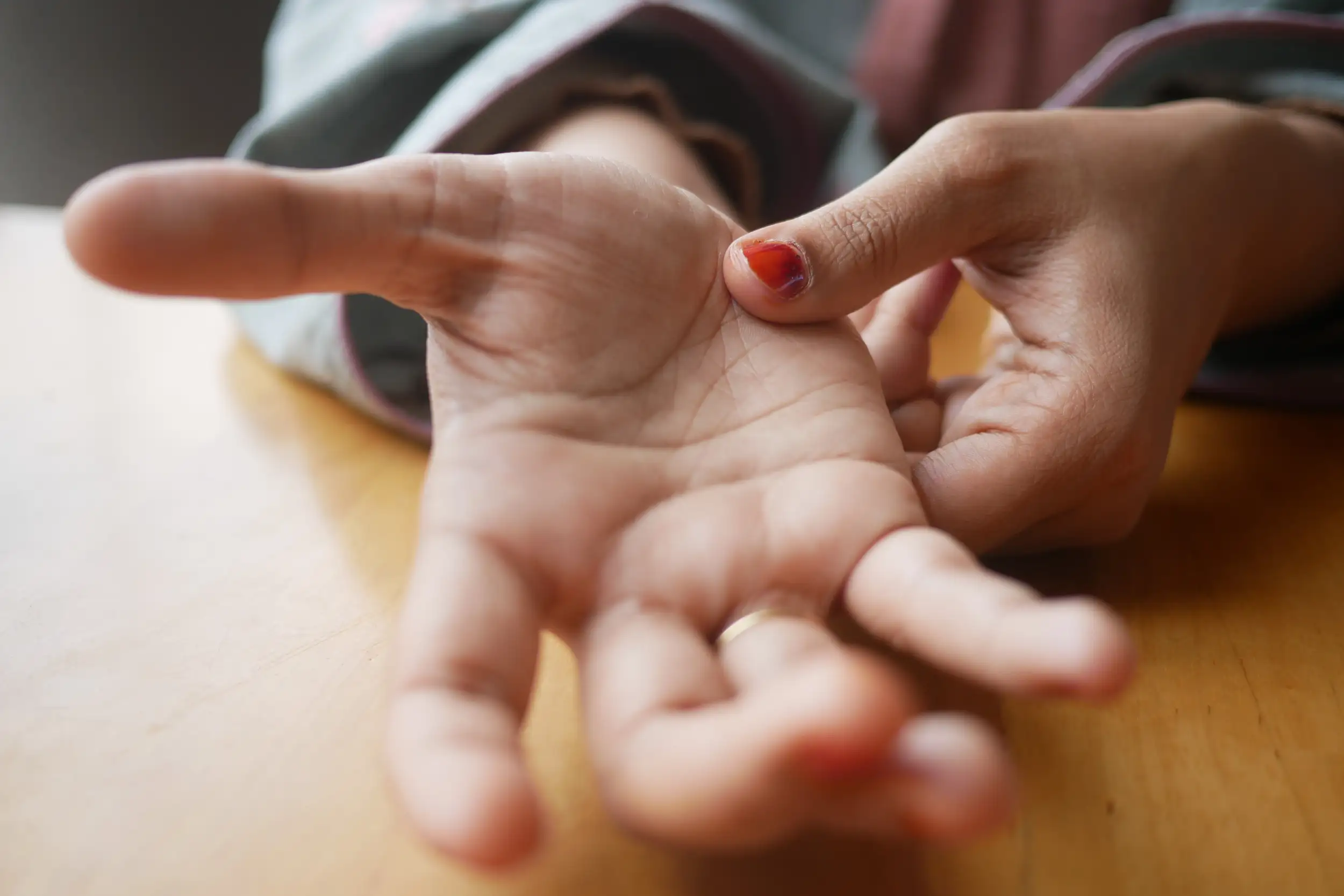 A zoomed image of a hand opening.